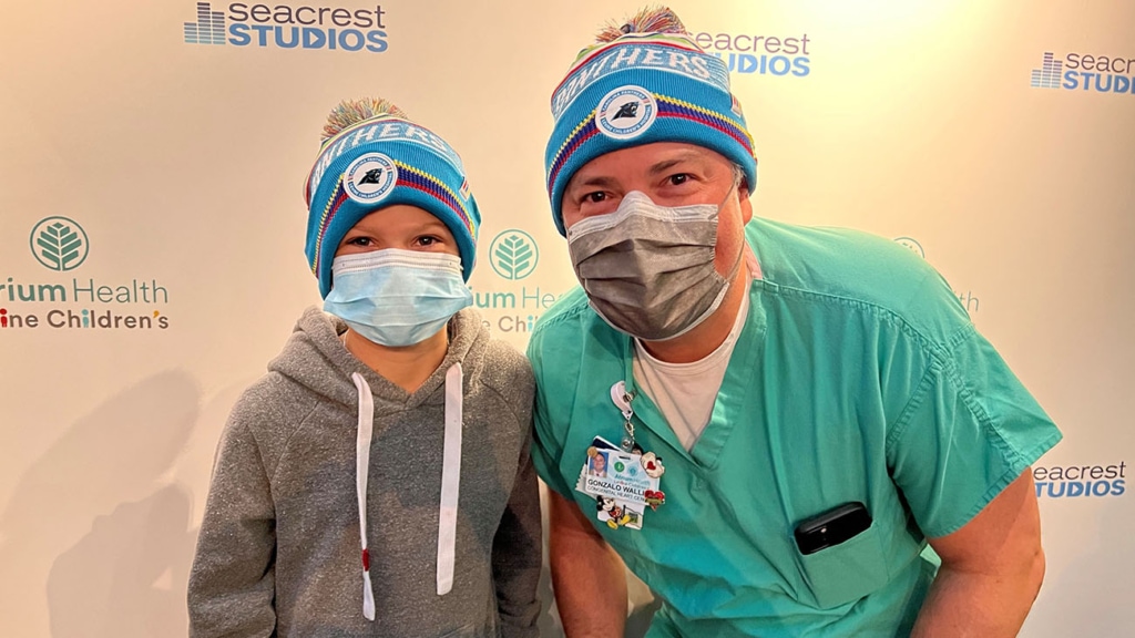 Dr. Wallis and TJ Olsen, son of former Panthers player Greg Olsen, after his heart transplant.